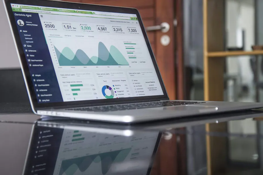 Laptop showing growth charts and analytics—organic search performance and reporting.